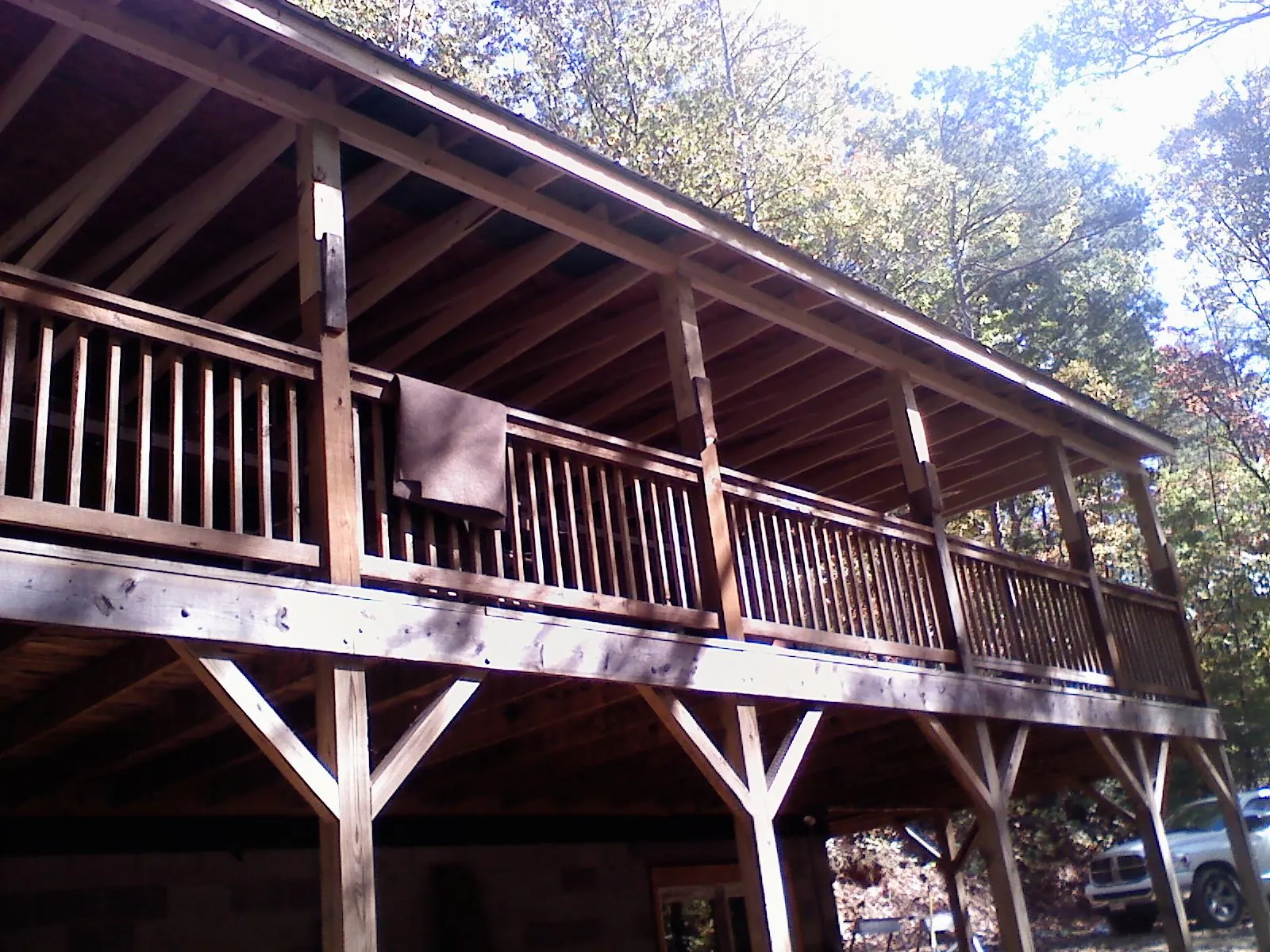 Timber framing under a new elevated porch and deck — Roof Leak Repair in Groveton by Roofing Brothers